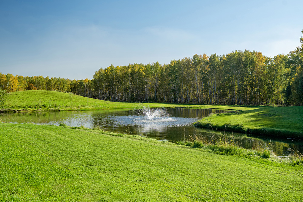 Aerating water fountain on a golf course retention pond located within our primary service areas.